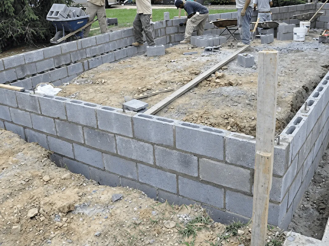 Professionals building a foundation with blocks in Pittsburgh, PA